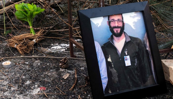 A photo of Alex Pretti, 37, can be seen at a makeshift memorial in the area where he was shot and killed by federal immigration agents earlier in the day in Minneapolis, Minnesota, January 24, 2026. — AFP