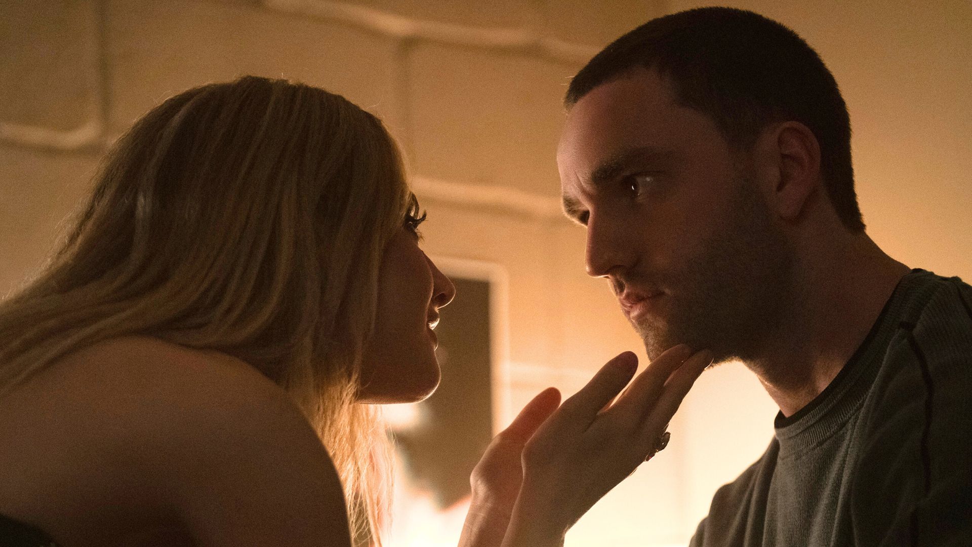 Lucy holds Stephen's face