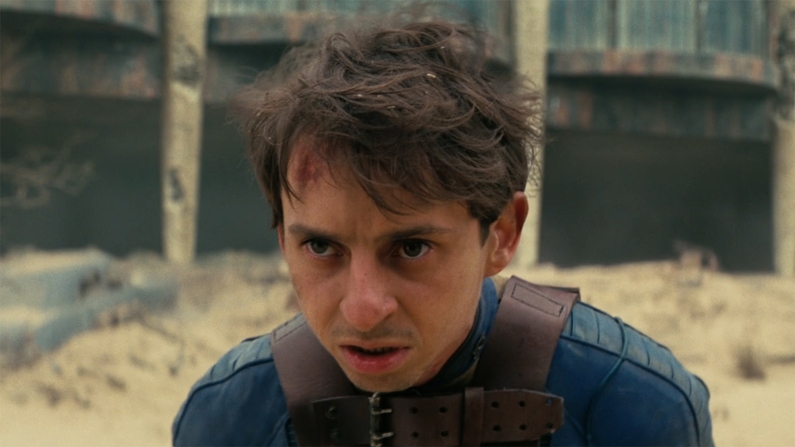 A close-up of a bloodied Norm in Episode 8 of Season 2 of Fallout