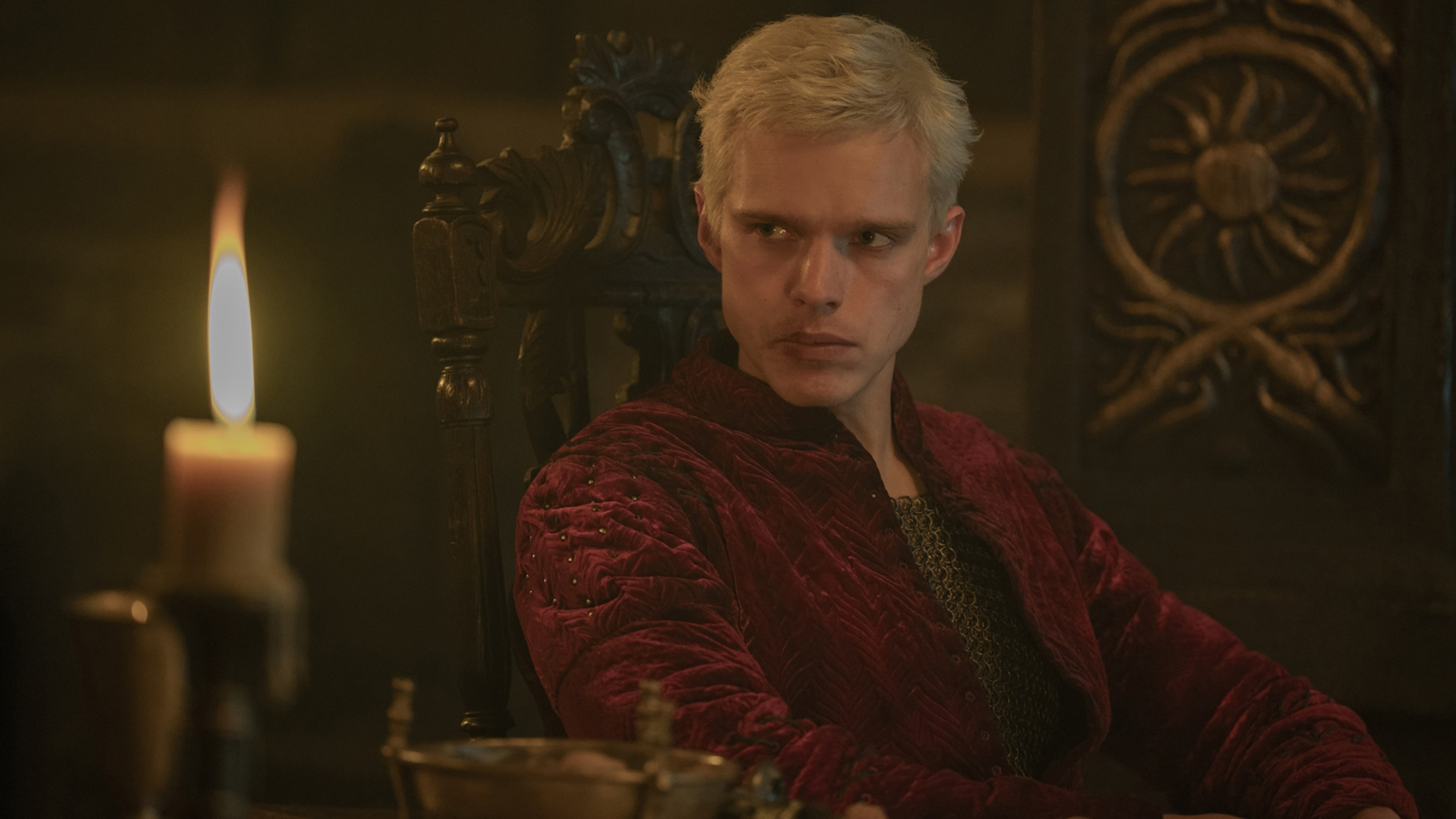 Aerion Targaryen sitting next to a lit candle in episode 4 of A Knight of the Seven Kingdoms