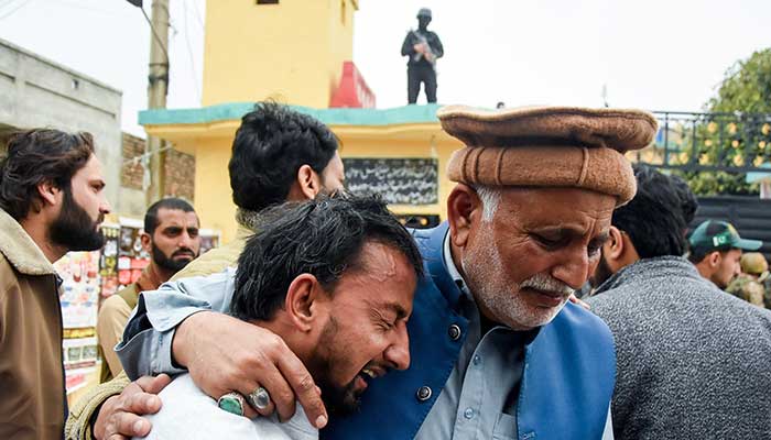 A man reacts while being comforted after a deadly explosion at a mosque in Islamabad, February 6, 2026. — Reuters