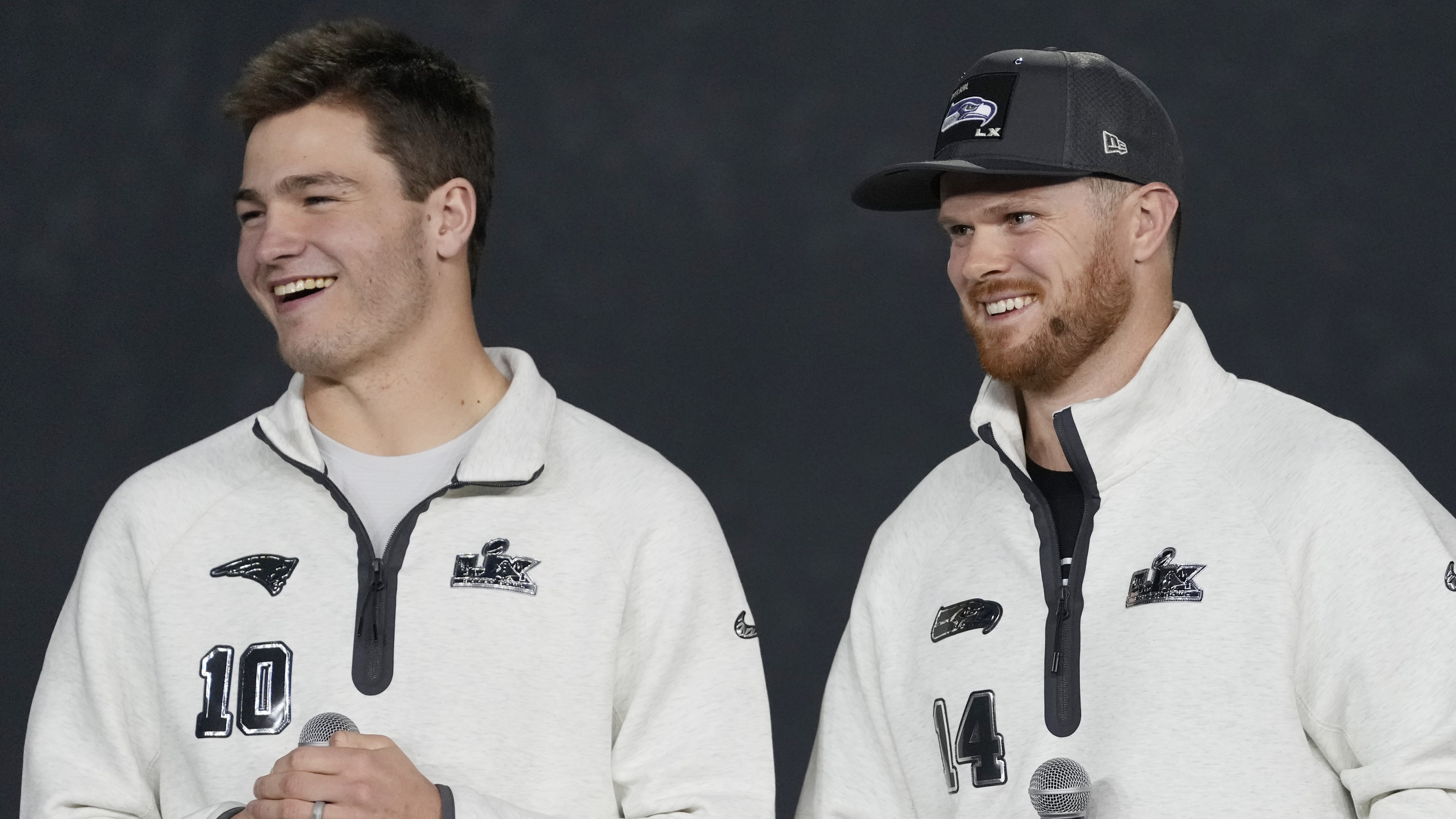Sam Darnold #14 of the Seattle Seahawks and Drake Maye #10 of the New England Patriots watch during opening night of Super Bowl LX at the San Jose McEnery Convention Center on February 2, 2026 in San Jose, California