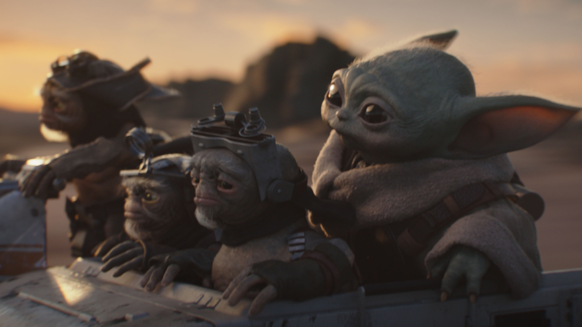 Bai, Clang, Keeto and Baby Yoda in a vehicle in The Mandalorian and Grogu