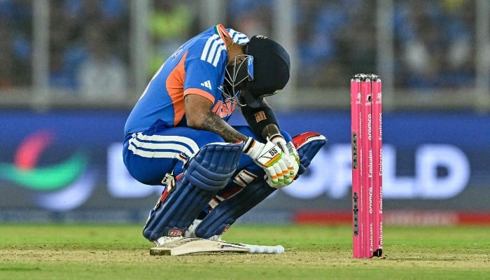 Indian captain Suryakumar Yadav reacts after being hit by the ball during the ICC Men's T20 Cricket World Cup 2026 Super Eights match between India and South Africa at the Narendra Modi Stadium in Ahmedabad on February 22, 2026. — AFP