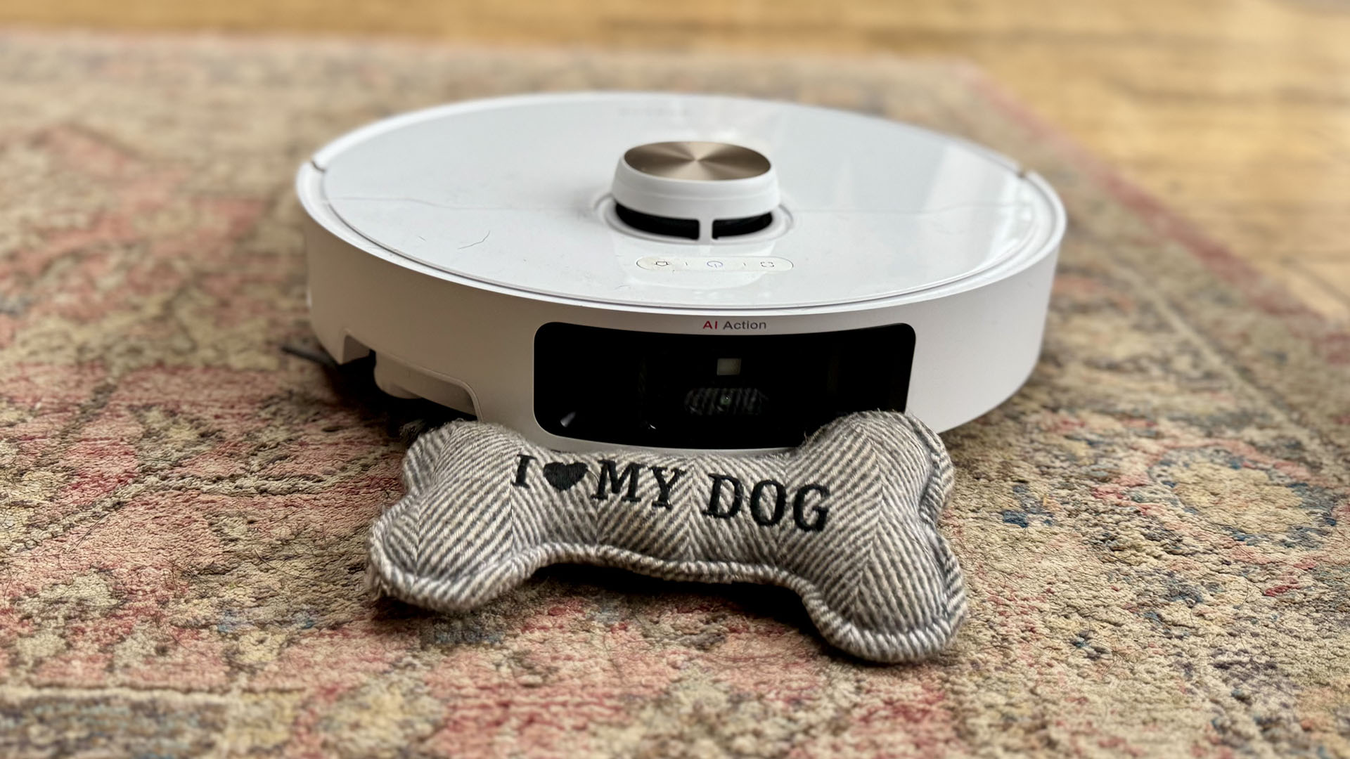 Dreame L40 Ultra robot vacuum cleaner on carpet with dog toy
