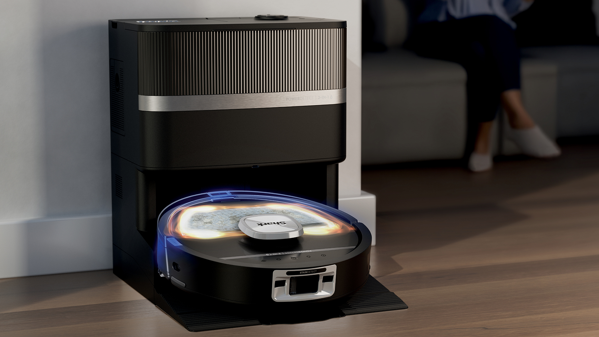 Graphic showing the Shark PowerDetect UV Reveal robot vacuum cleaning a room