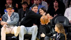 Justin Herbert goes viral for saving Madison Beer from flying basketball during Lakers game amid romance rumors