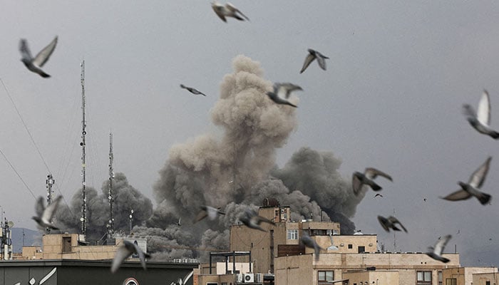 Birds fly as smoke rises from an explosion, after Israel and the United States launched strikes against Iran, amid the U.S.-Israeli conflict with Iran, in Tehran, Iran, March 2, 2026. — Reuters