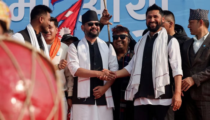 Balendra Shah, former mayor of Kathmandu better known as Balen, who party officials say will become prime minister under an internal agreement if the Rastriya Swatantra Party (RSP) wins the March 5 elections, shakes hands with Rabi Lamichhane, president of the Rastriya Swatantra Party (RSP) during an election campaign in Janakpur, Nepal, January 19, 2026. — Reuters