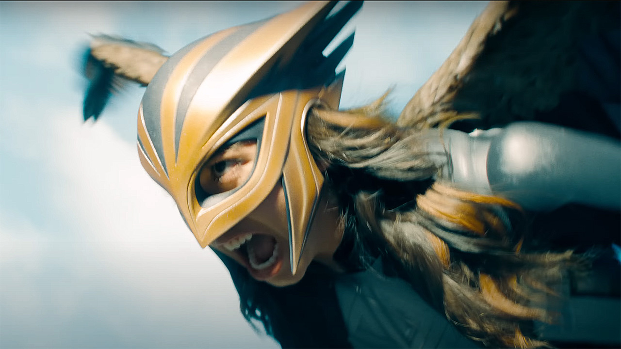 A close-up of Hawkgirl flying and screaming in Superman