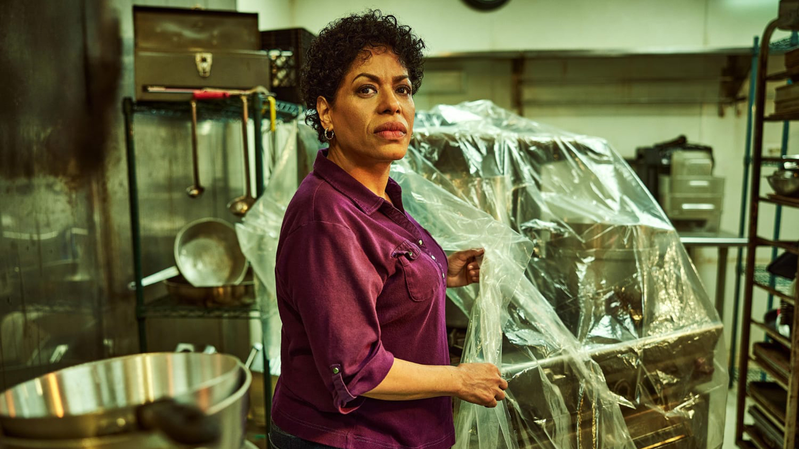Tina standing in a restaurant kitchen in The Bear