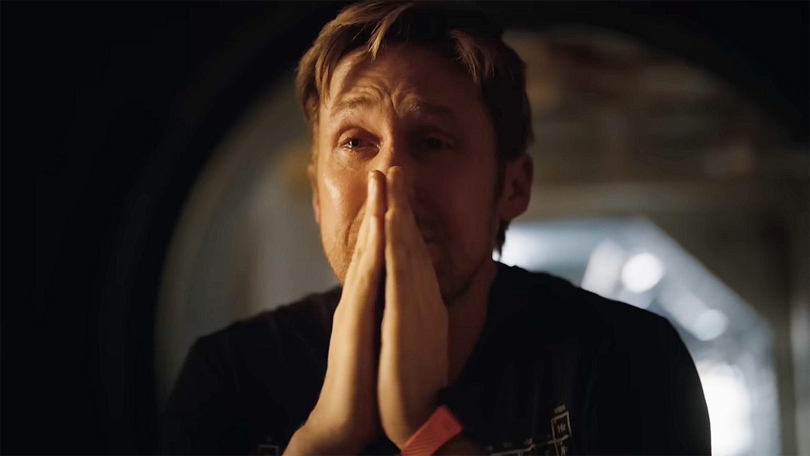 Ryland Grace cries and prays with his hands in the Hail Mary Project