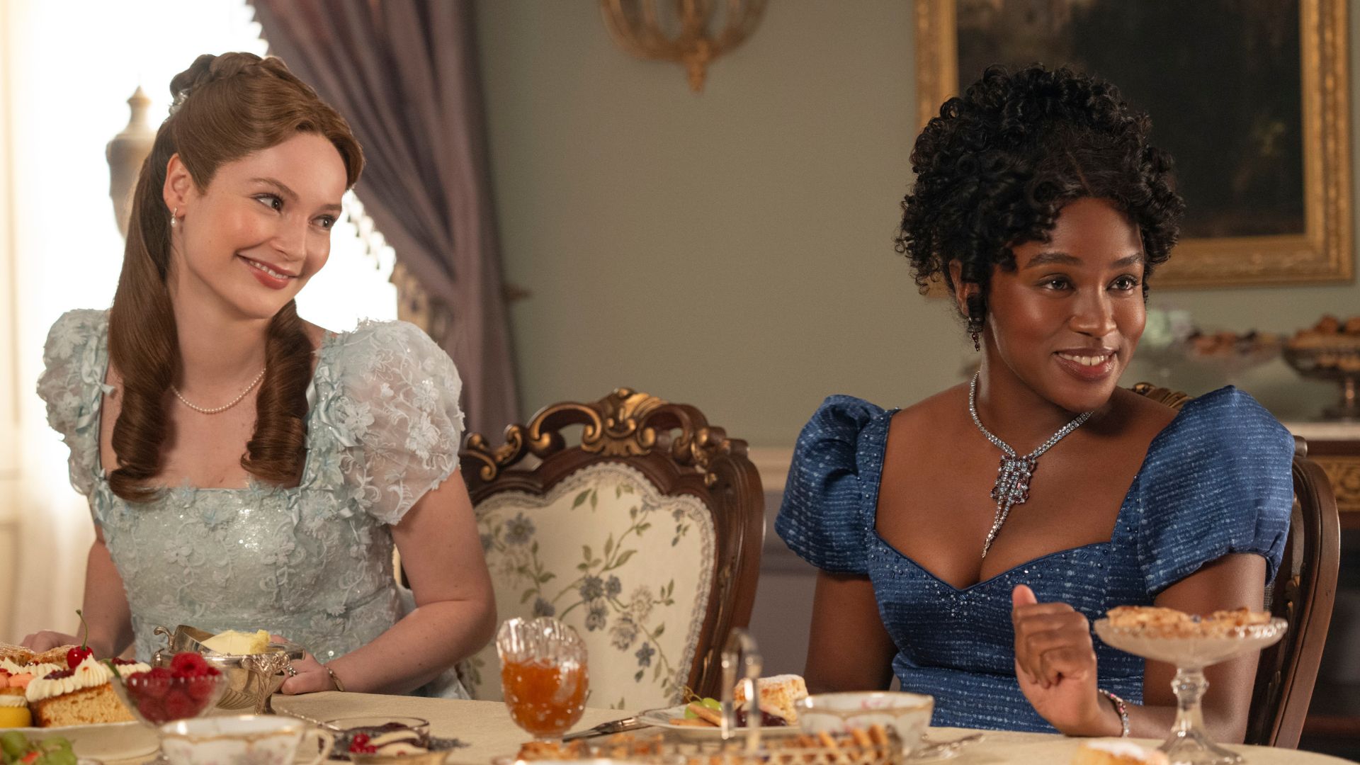 Francesca smiles at Michaela at the dining room table