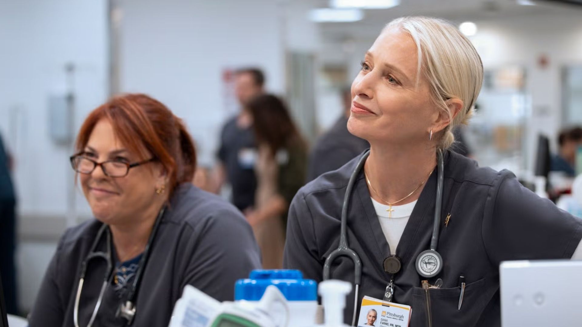 Dana and the nursing team are watching something off-screen.