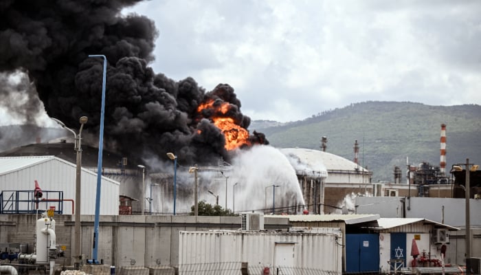 A fire after Israeli fire and rescue services said an industrial building and a tanker truck at Israeli oil refineries were hit by debris from an intercepted Iranian missile, amid the U.S.-Israeli conflict with Iran, in Haifa, Israel, March 30, 2026. — Reuters