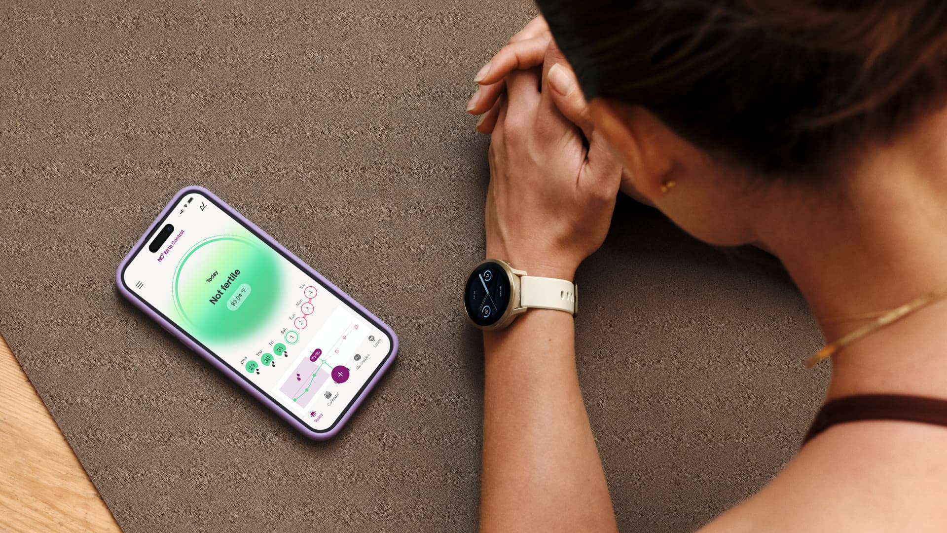 An iPhone and Garmin smartwatch displaying a person's cycle tracking information.