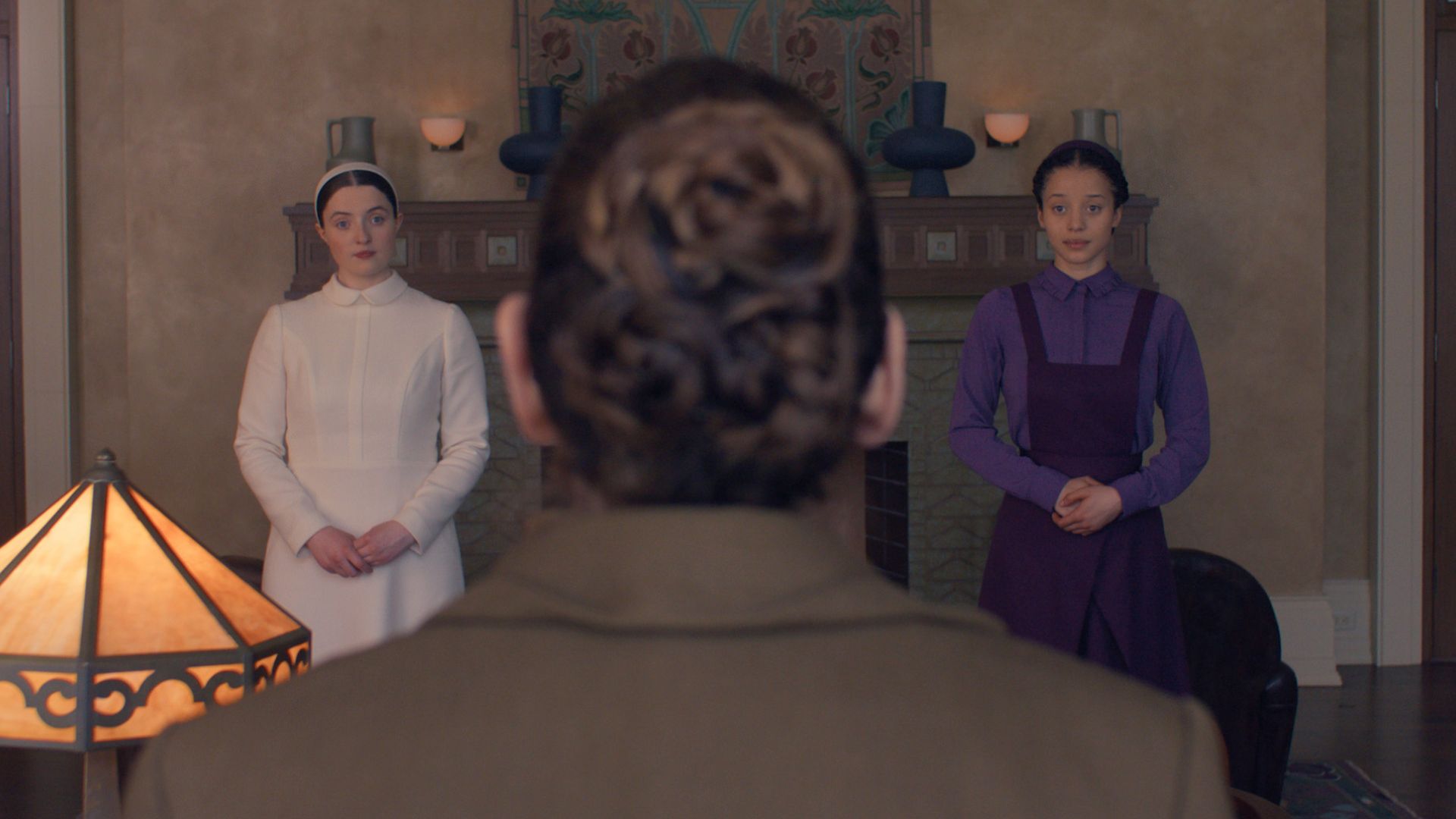 Daisy and Agnes appear on either side of the back of Aunt Lydia's head.