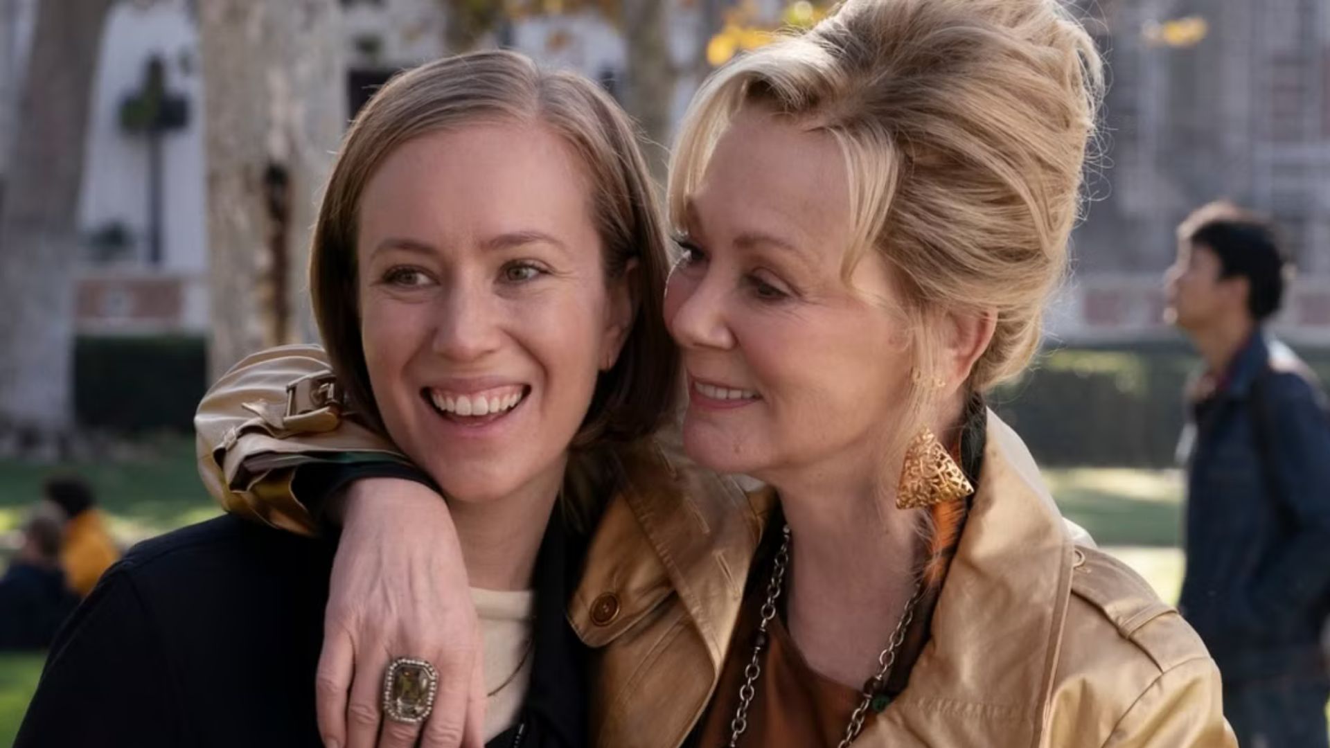 Deborah puts her arm around Ava's shoulders.