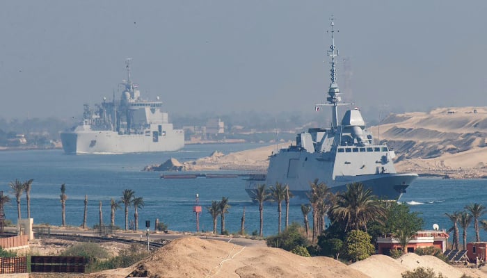 A photo released by the Marine Nationale (French Navy) on May 6, 2026 shows the French Navy carrier group that includes the flagship aircraft carrier Charles de Gaulle (unseen) and its escort transiting the Suez Canal en route to the southern Red Sea to preposition for a possible mission to restore navigation in the Strait of Hormuz. -AFP