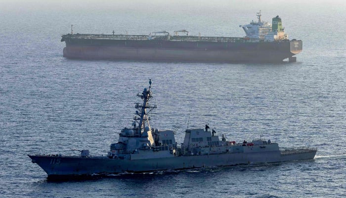 This US Navy photo, released May 7, 2026, by US Central Public Affairs Command, shows the Arleigh Burke-class guided-missile destroyer USS Rafael Peralta (DDG 115) applying a maritime blockade against the Iranian-flagged tanker Stream as it attempted to sail to an Iranian port, April 26, 2026. — AFP