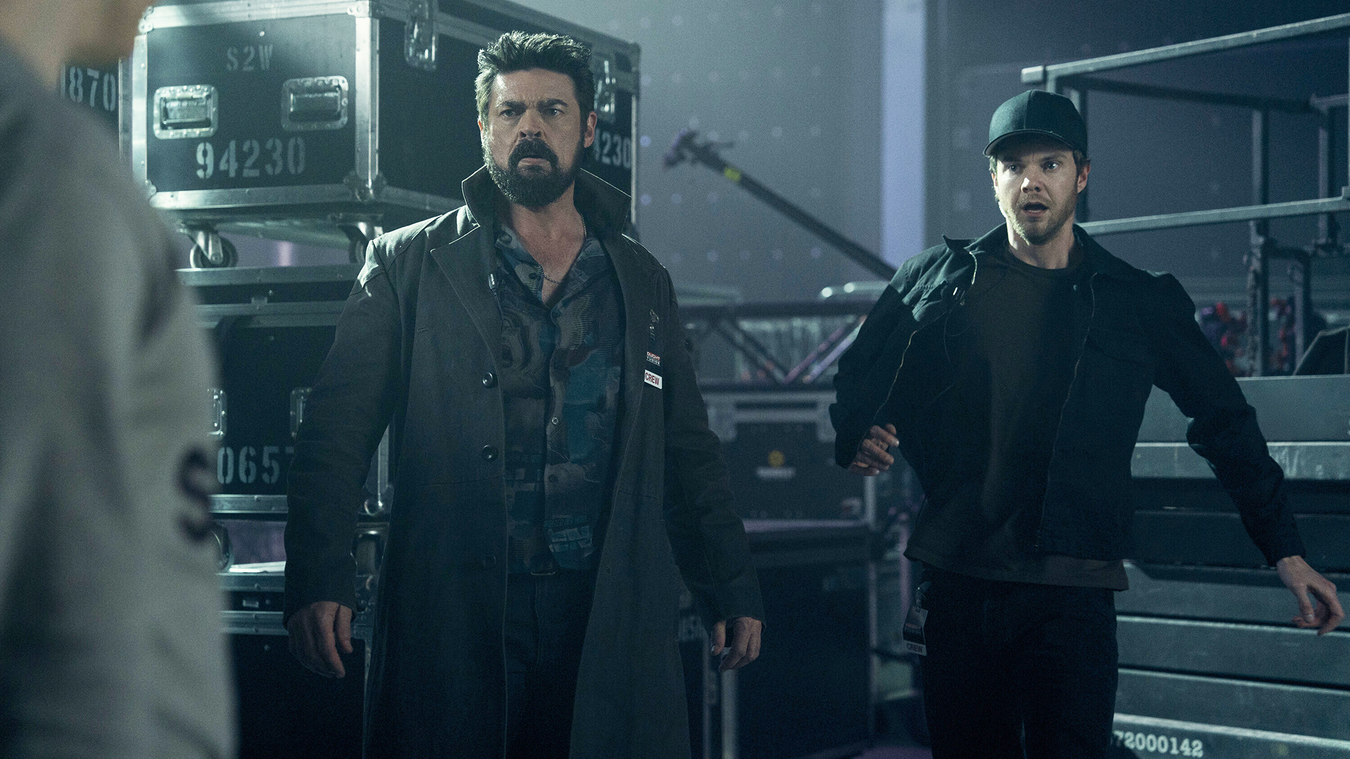 Billy and Hughie look shocked by someone off-camera in The Boys Season 5 Episode 7