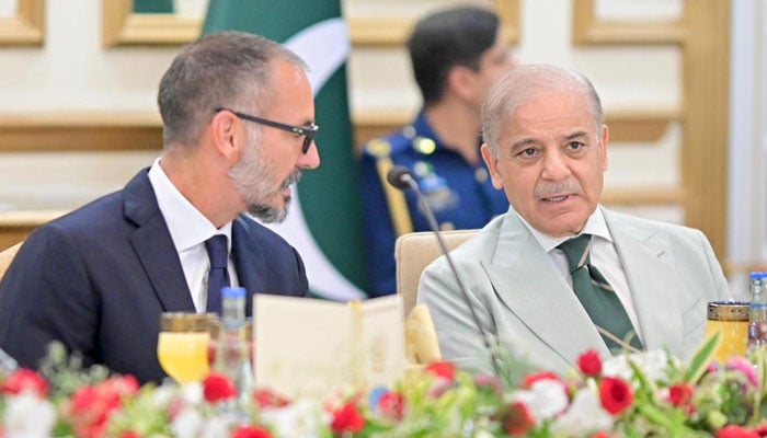 Prince Rahim Aga Khan V speaks with Shehbaz Sharif during a breakfast at the Prime Minister's House in Islamabad on May 21, 2026. — PID