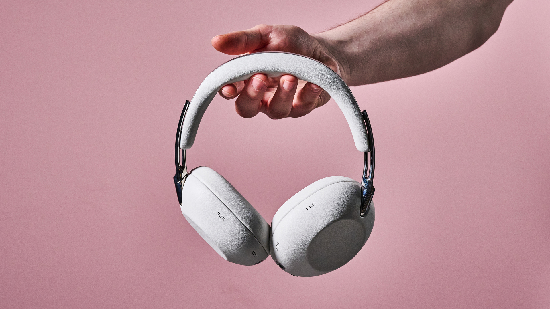 Man holding Sony 1000X The Collexion headphones