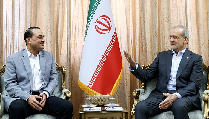 Iranian President Masoud Pezeshkian (R) meets with Defense Forces Chief and Army Chief of Staff Marshal Asim Munir in Tehran on May 23, 2026. — Reuters