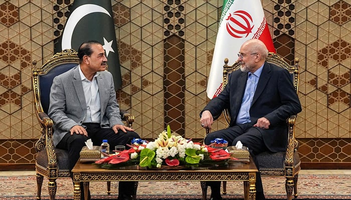 Iranian Parliament Speaker Mohammad Bagher Ghalibaf (R) meets with Defense Force Chief and Army Chief of Staff Marshal Asim Munir in Tehran on May 23, 2026. — Reuters