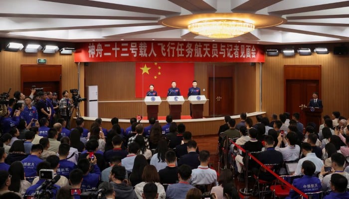 Astronauts Zhu Yangzhu, Zhang Zhiyuan and Lai Ka-ying, who is Hong Kong's first astronaut, attend a press conference ahead of the Shenzhou-23 spaceflight mission to China's Tiangong space station, at the Jiuquan Satellite Launch Center near Jiuquan, Gansu province, China, May 23, 2026. — Reuters