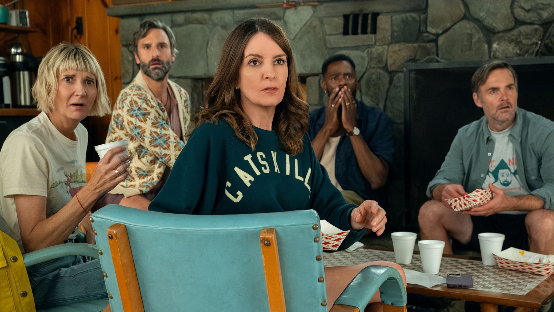 The Four Seasons cast looks shocked by something across the room