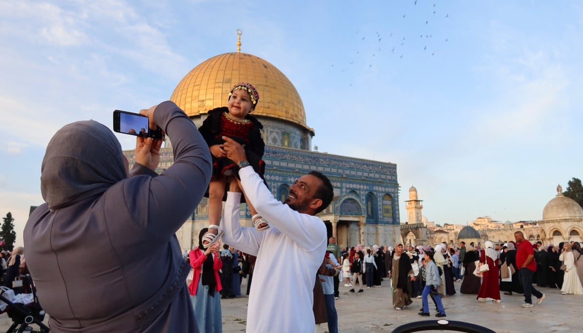 Palestinian families celebrate Eid ul Adha at Al-Aqsa Mosque in Jerusalem on May 27, 2026. — Reuters