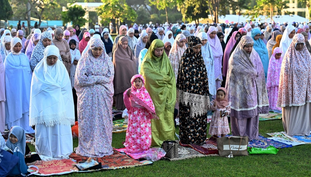 11. Muslim worshipers pray for Eid ul Adha, or Feast of Sacrifice, in Denpasar on the Indonesian resort island of Bali on May 27, 2026. — AFP