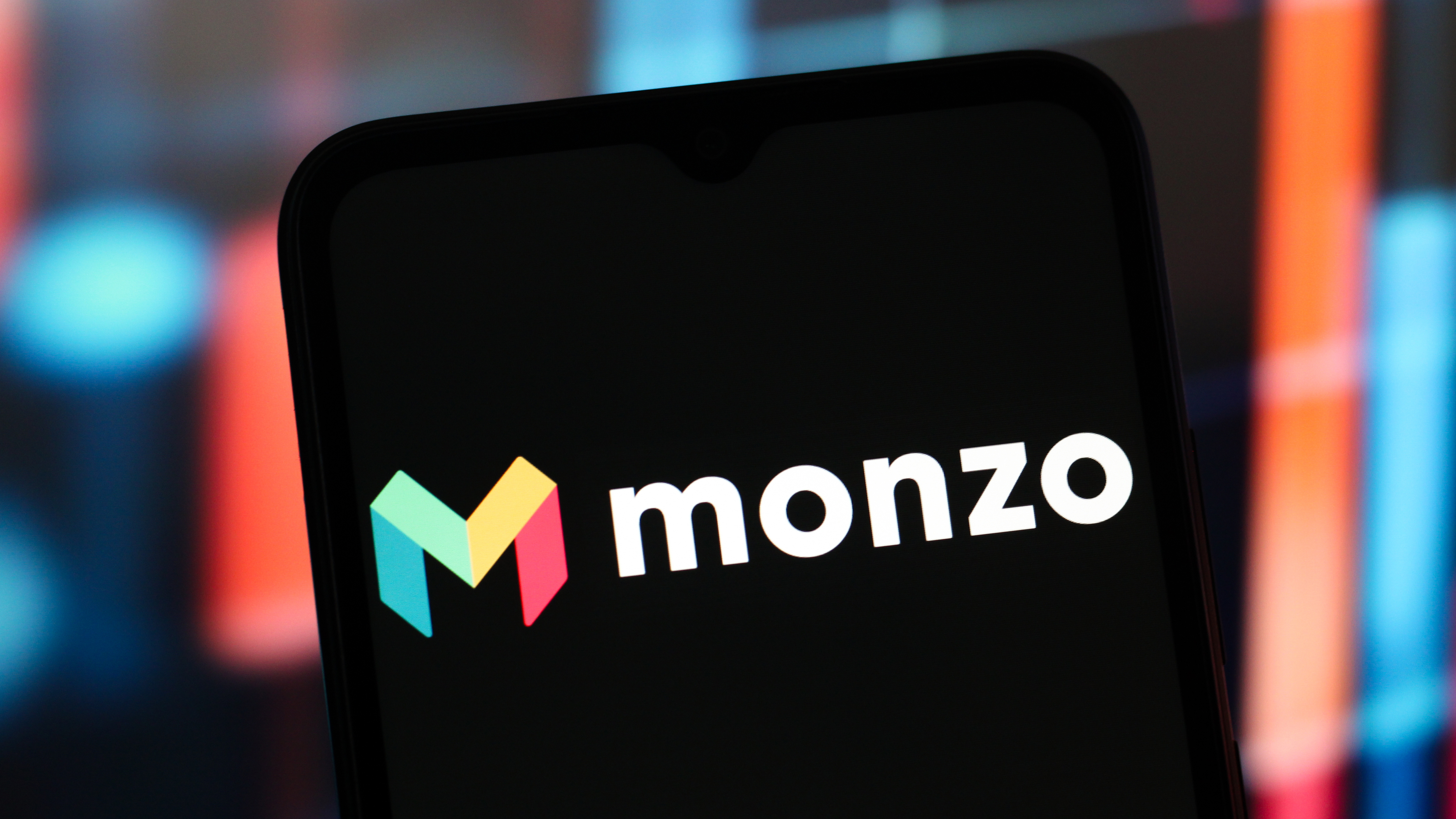 A phone displaying the Monzo logo