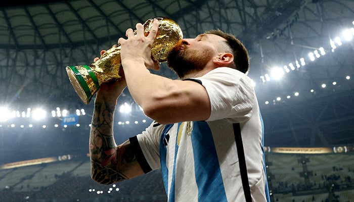 Argentina's Lionel Messi kisses the trophy as he celebrates his World Cup victory, Fifa World Cup Qatar 2022 - Final - Argentina v France - Lusail Stadium, Lusail, Qatar - December 18, 2022. — Reuters