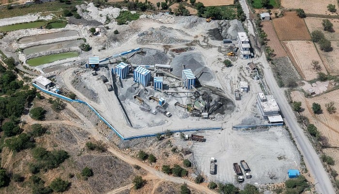 This aerial photograph taken on May 19, 2026 shows a stone crushing plant near a quarry in the Aravalli mountain range in Rajasthan's Neem ka Thana town. -AFP