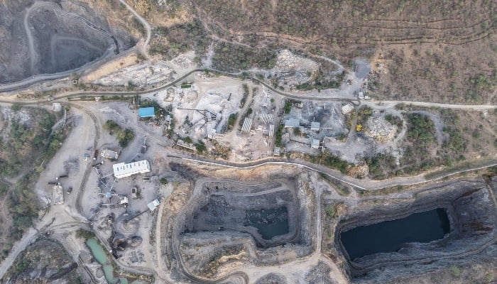 This aerial photograph, taken on May 18, 2026, shows an open-air stone quarry in the Aravalli mountain range in the town of Neem ka Thana, Rajasthan. -AFP