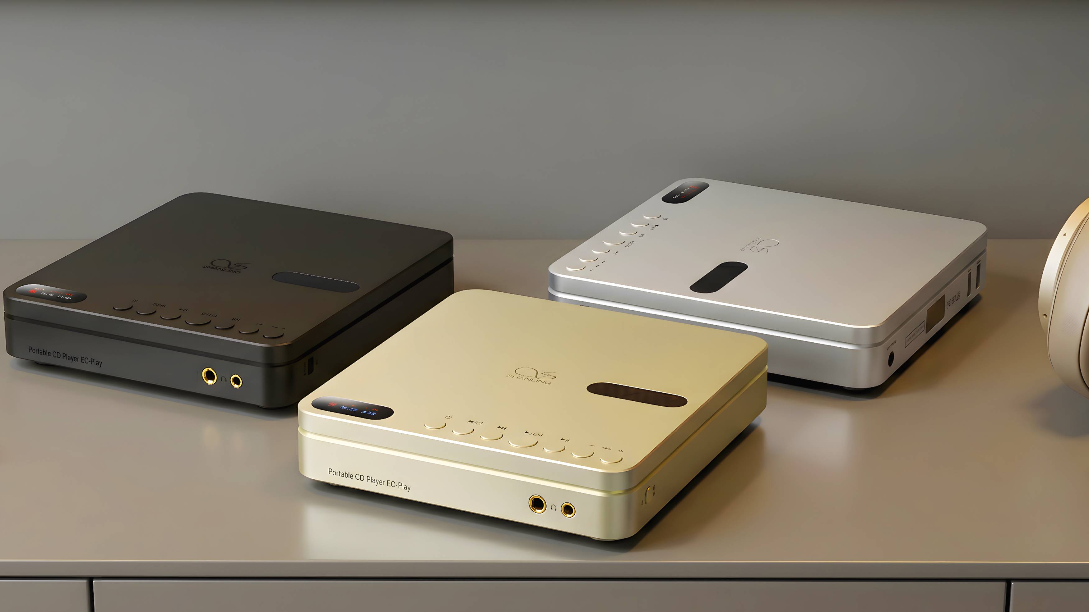 Three different colored models of Shanling EC Play on a shelf.