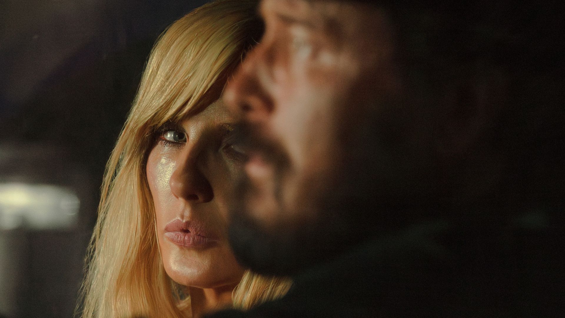 Beth looks at Rip sitting next to her