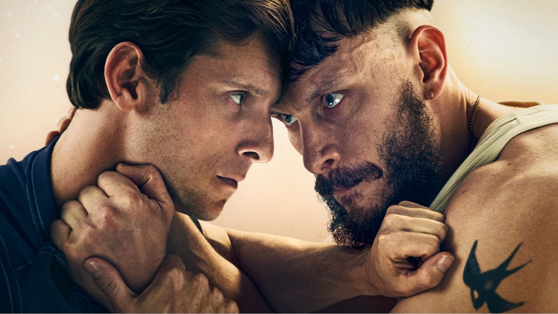 Jamie Bell and Richard Gadd hold each other in an uncomfortable grip