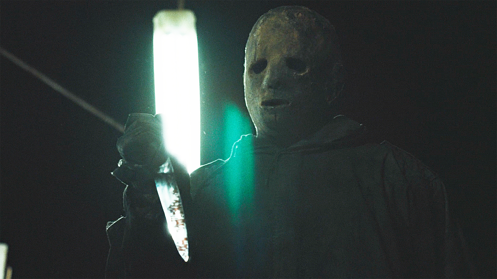 A close-up of the Boogeyman holding a knife at night in episode 8 of Widow's Bay