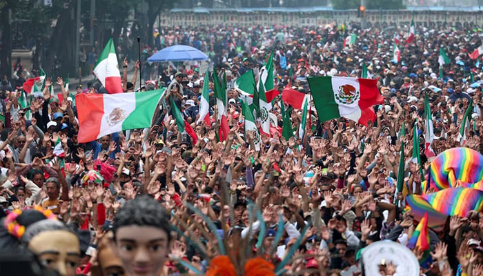 People take part in an attempt to break the Guinness World Record for the world's largest Mexican wave along Reforma Avenue as part of activities leading up to the 2026 FIFA World Cup, in Mexico City, Mexico, June 6, 2026. — Reuters