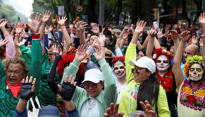 People take part in an attempt to break the Guinness World Record for the world's largest Mexican wave along Reforma Avenue as part of activities leading up to the 2026 FIFA World Cup, in Mexico City, Mexico, June 6, 2026. — Reuters