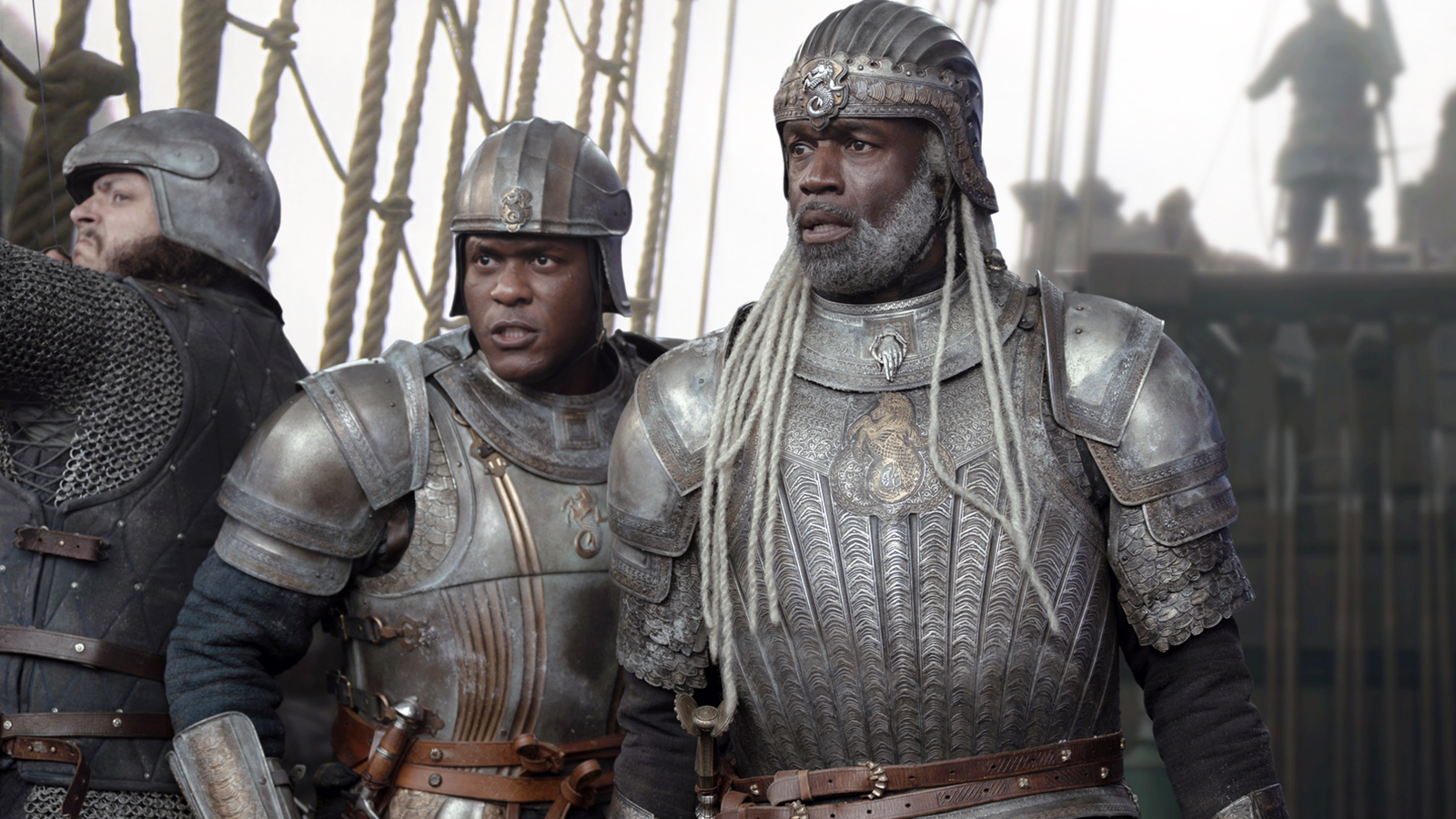 Alyn and Corlys watch something off-camera while standing on the deck of a ship in House of the Dragon, season 3, episode 1