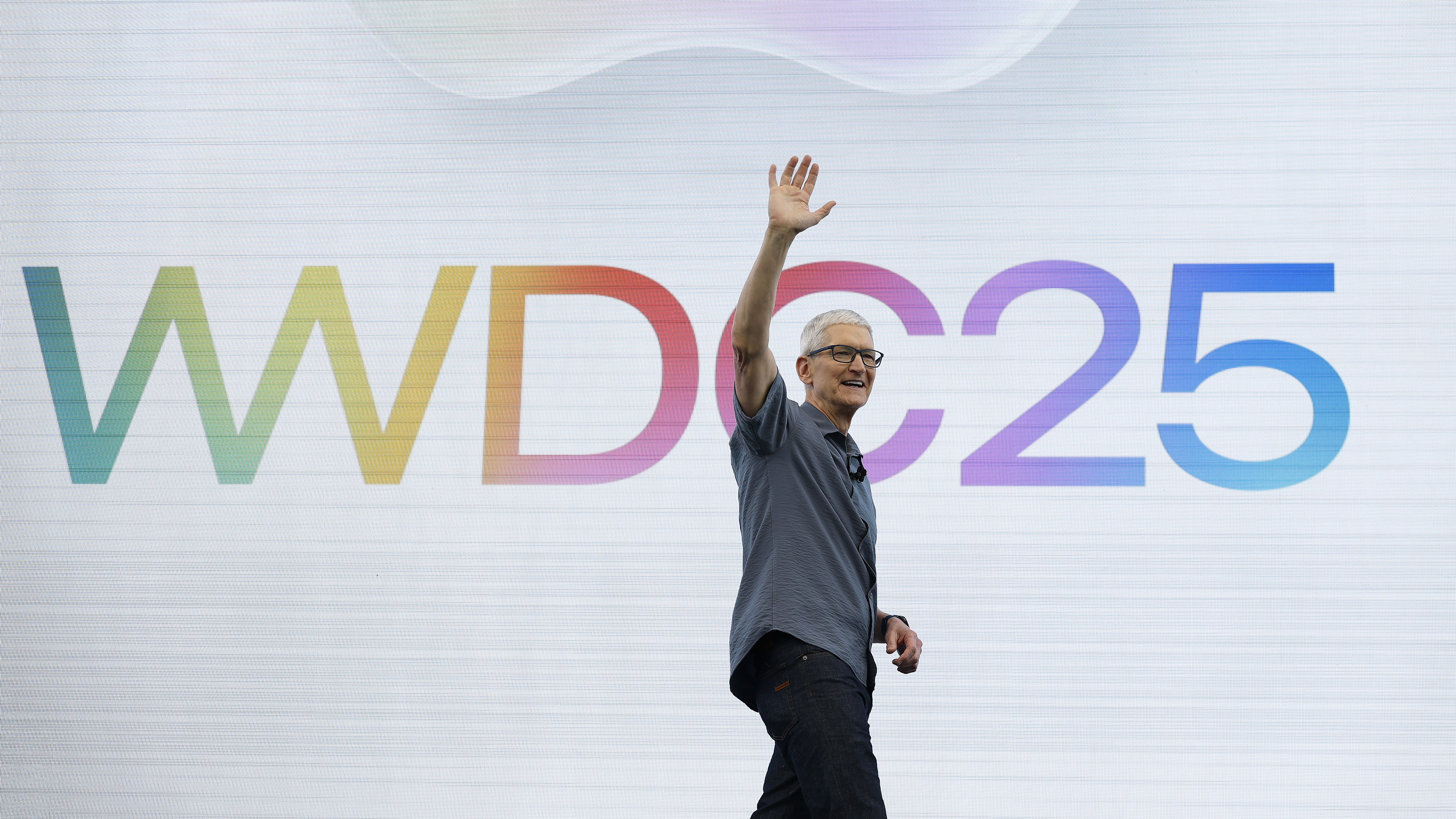 Tim Cook saluting on stage at WWDC 2025