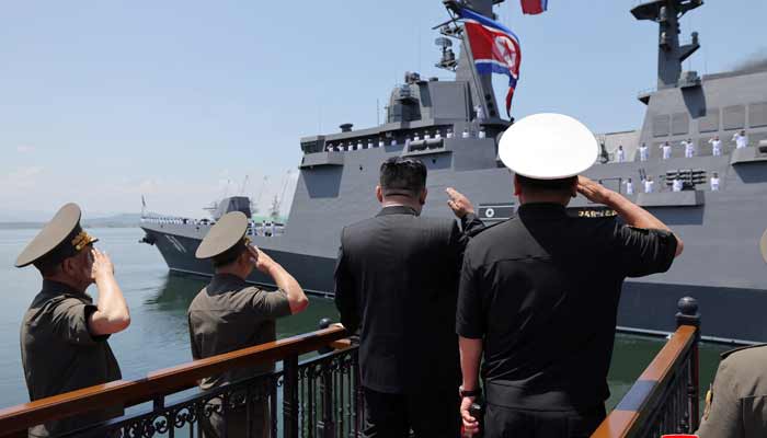 North Korean leader Kim Jong Un salutes during the commissioning ceremony of the new multi-purpose destroyer Choe Hyon at the port of Nampho, North Korea, June 23, 2026, in this photo released by the North Korean official news agency.