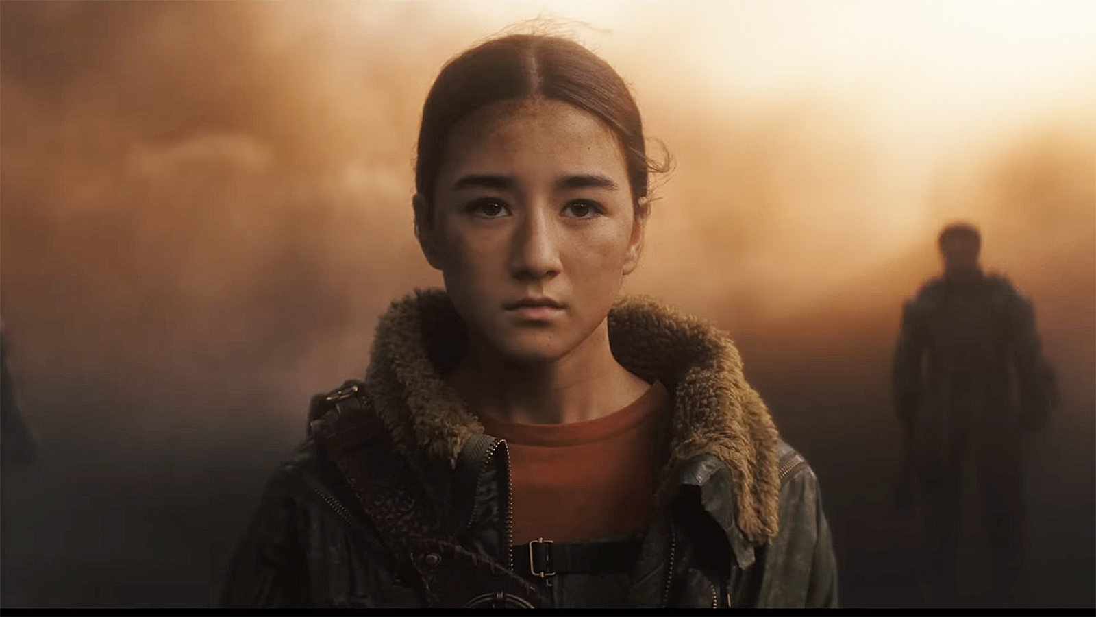 Ruthye standing in a dust covered place in Supergirl