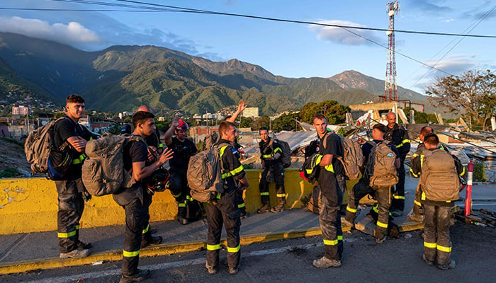 Members of the French Civil Security Training and Intervention Regiment (UIISC 7) travel to an area affected by building collapses in La Guaira state, Venezuela, June 28, 2026, following earthquakes. -AFP
