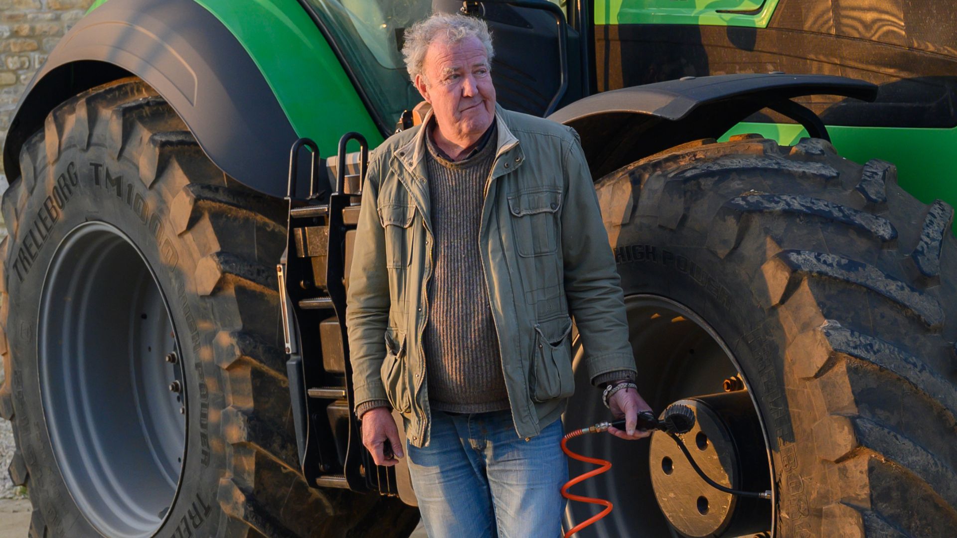 Jeremy puts tires on a tractor