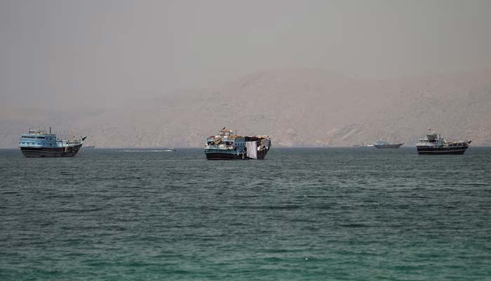 Ships in the Strait of Hormuz, seen from Musandam, Oman, June 22, 2026. — Reuters